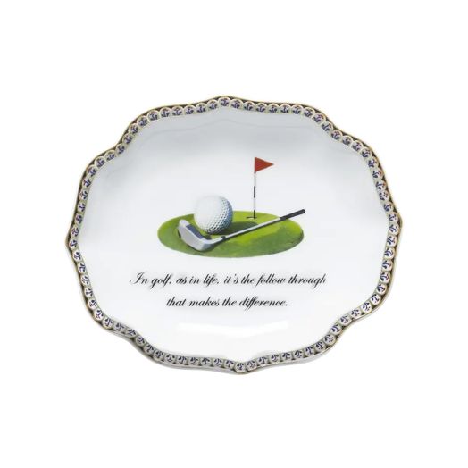 porcelain ring tray with golf club motif and the inscription "In golf, as in life, it's the follow through that makes the difference"