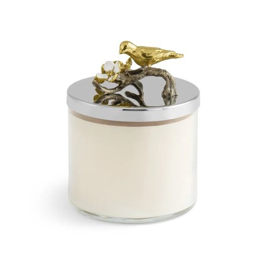 glass candle with silver lid accented with bird on branch