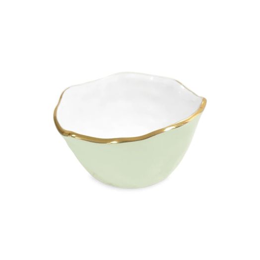 pistachio colored bowl with white interior and golden rim