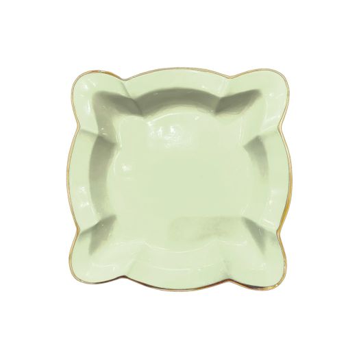 pistachio colored napkin holder with unique design and golden rim