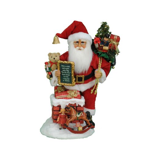 Santa figurine standing at the chimney with gifts