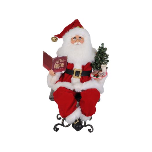 Santa figurine holding a book and telling a story