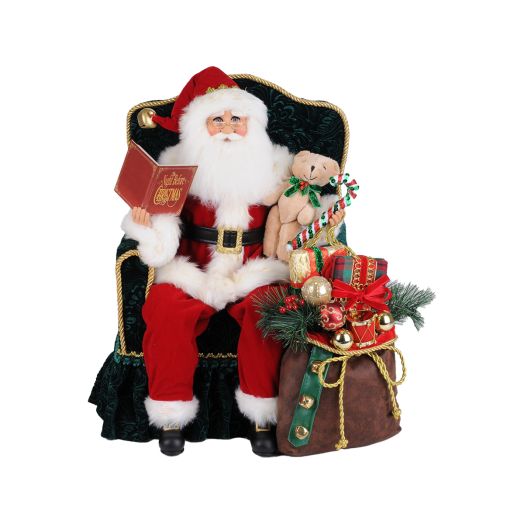 Santa figurine sitting in a chair with presents