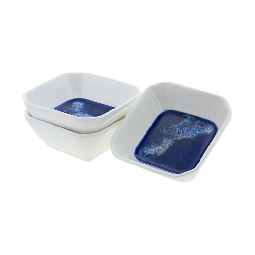 three white dipping bowl with unique blue pattern in the bottom