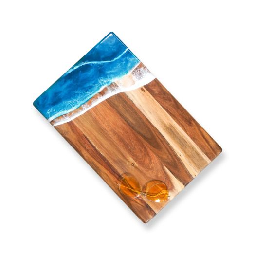 large rectangular wooden board with white and blue resin design